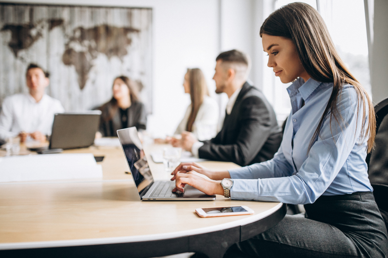 Colleagues working together around a conference table