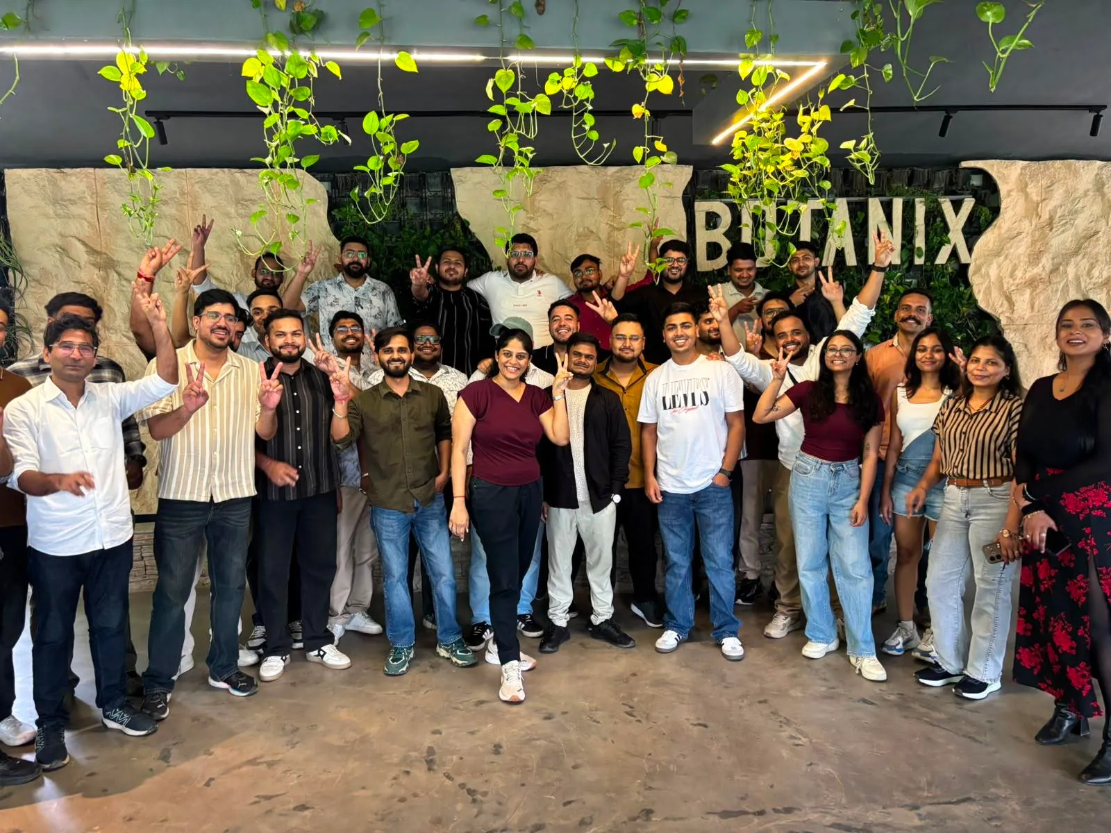 The Spektra Systems team gathered for a group photo at a team dinner